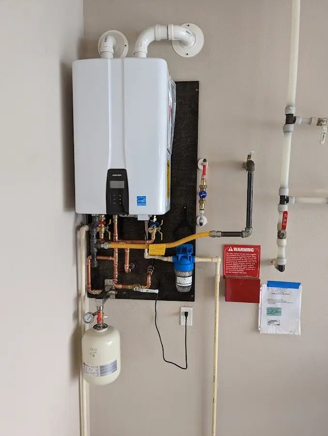 Professional plumber installing copper piping in a Waynesboro home